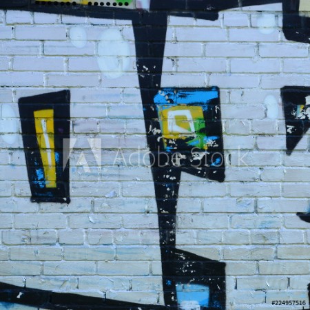 Image de Fragment of graffiti drawings The old wall decorated with paint stains in the style of street art culture Colored background texture